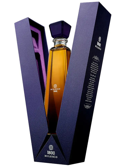 Bottle of 1800 Milenio tequila in a purple box on a white background