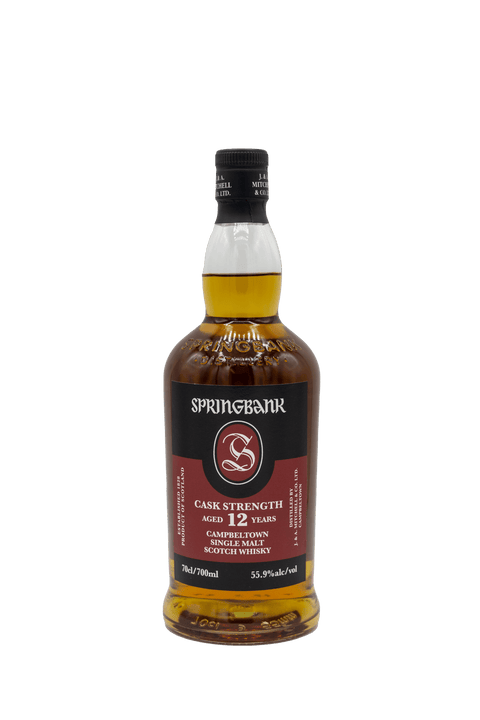 Springbank 12-year-old whisky bottle on a green background