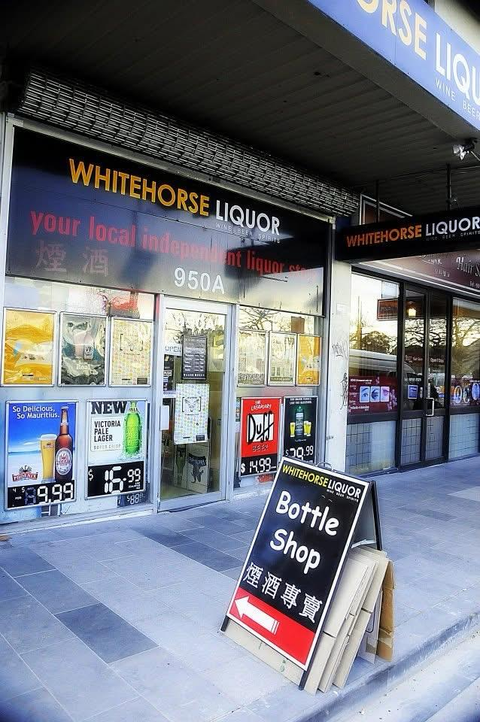Whitehorse Liquor store front with a sign indicating it's a bottle shop.